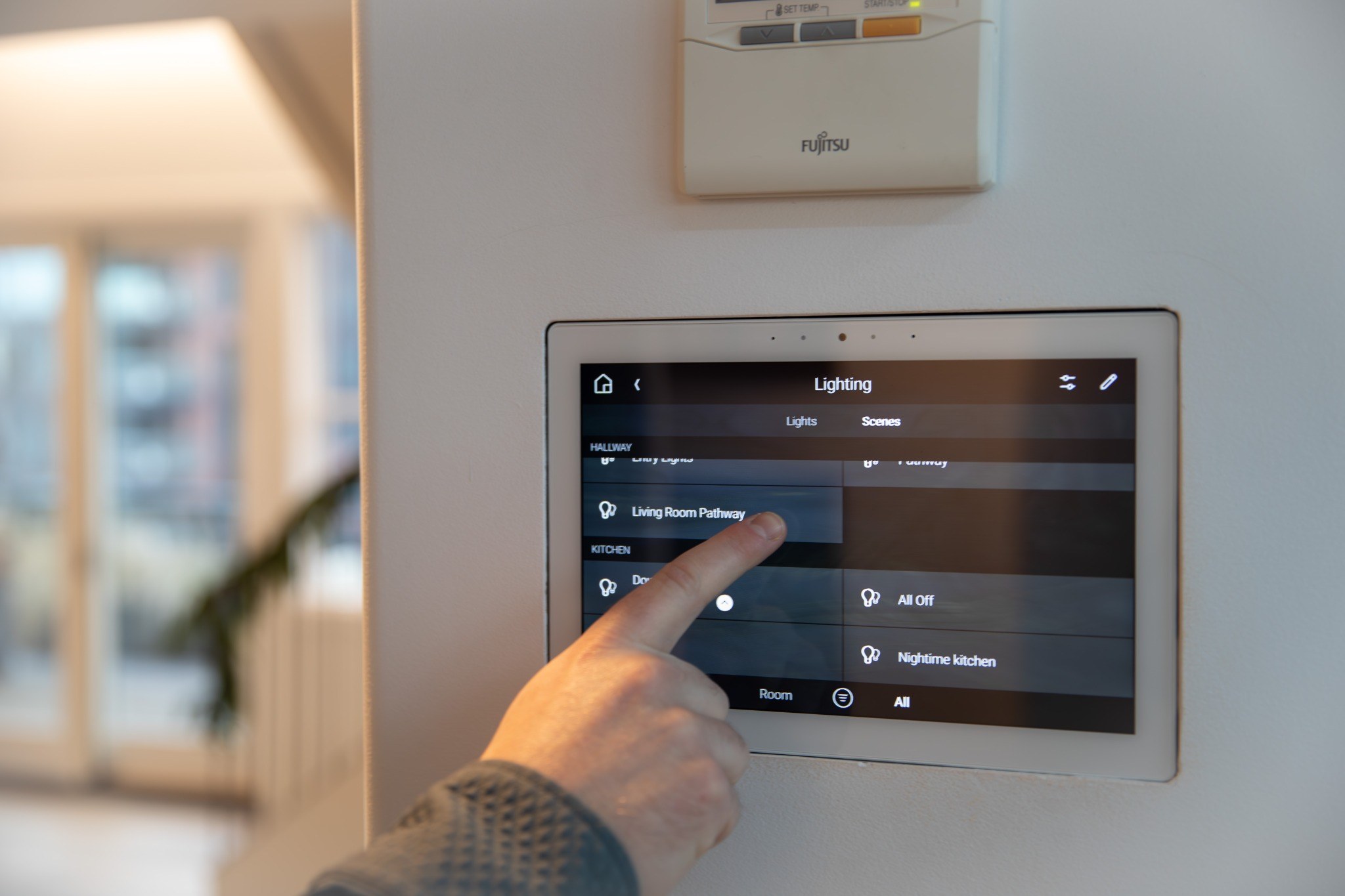 Control4 wall touchscreen with lighting scene controls