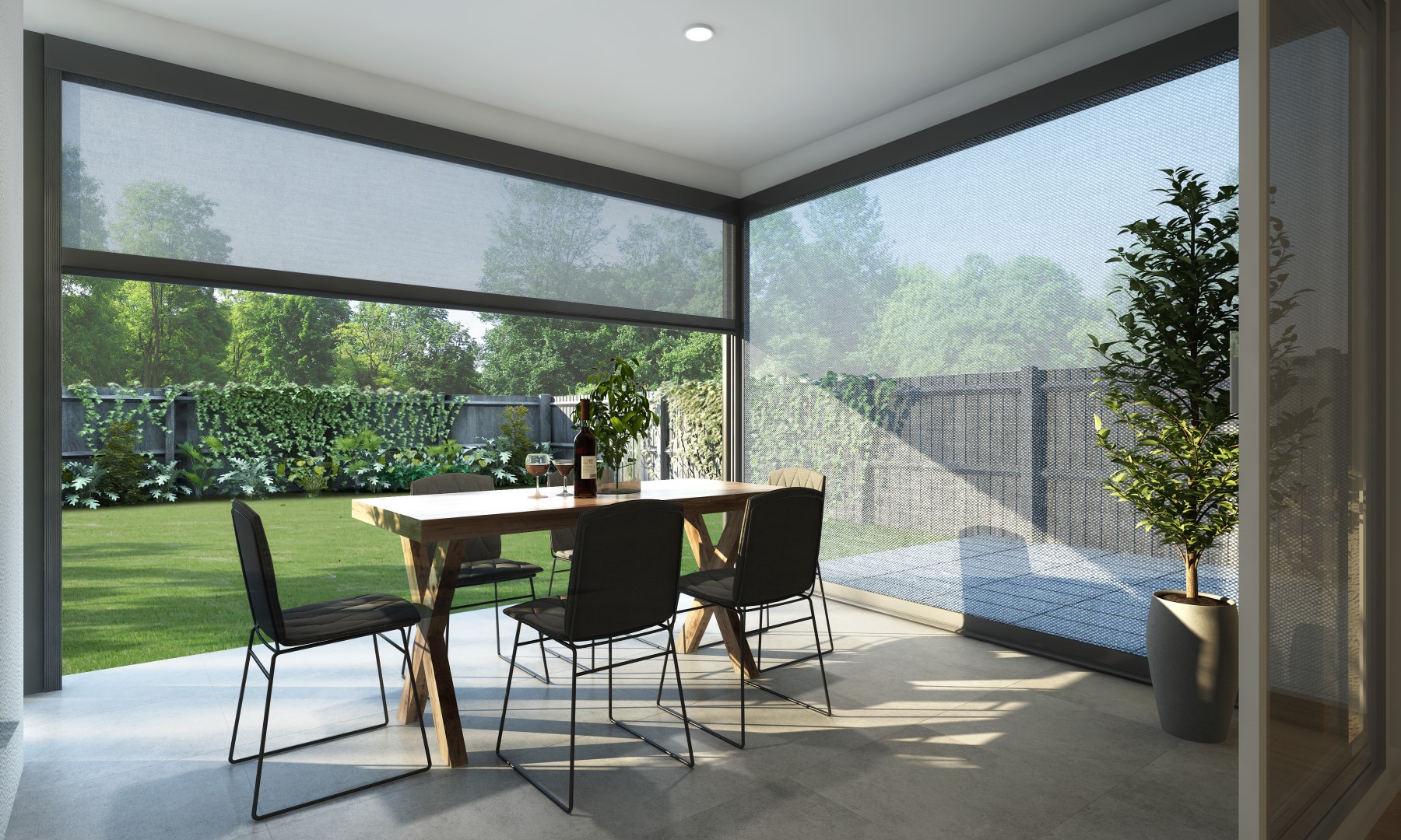Partially lowered screen shades around a covered patio dining area